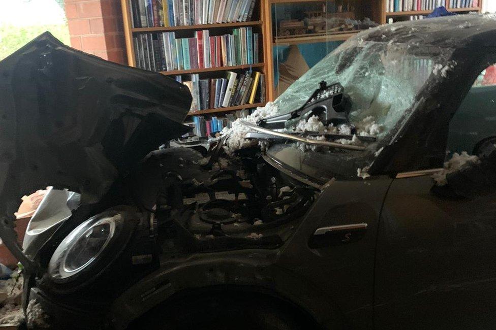 Car embedded in Sandiacre library