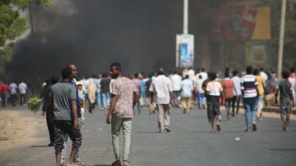 People protest near the army HQ in Khartoum