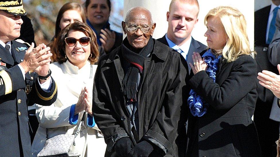 Richard Overton (C) is acknowledged by US President Barack Obama (not pictured) during a ceremony to honour veterans at Arlington National Cemetery in Arlington, Virginia, on 11 November 2013