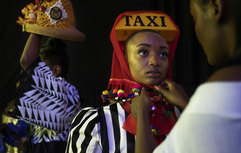 Models get ready backstage prior to walk down the runway at the Hub of Africa, Addis Fashion Week in Addis Ababa, on October 03, 2018