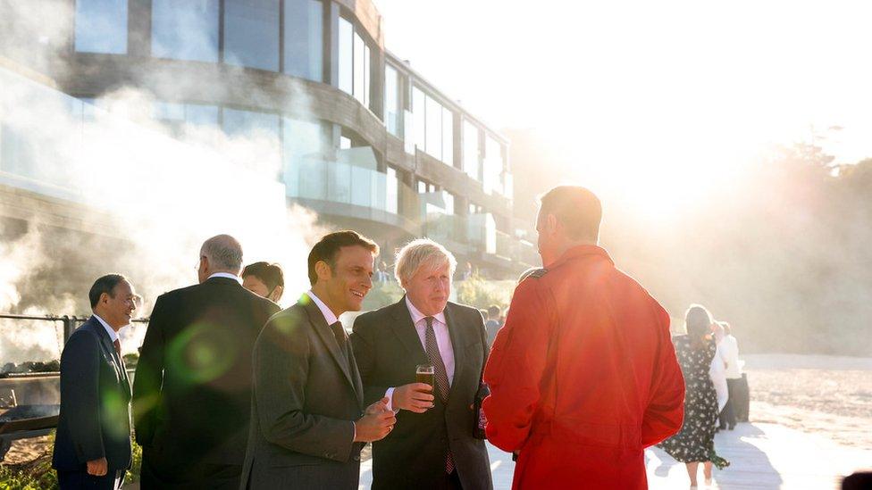 Emmanuel Macron and Boris Johnson chat with Red Arrows official at G7 summit