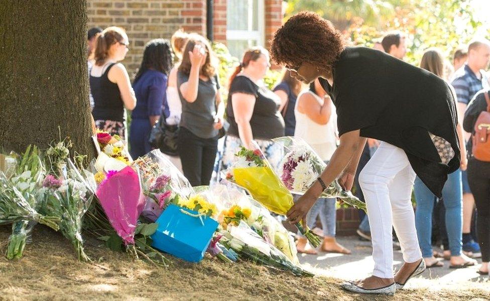 People lay flowers Lennard Road in Penge