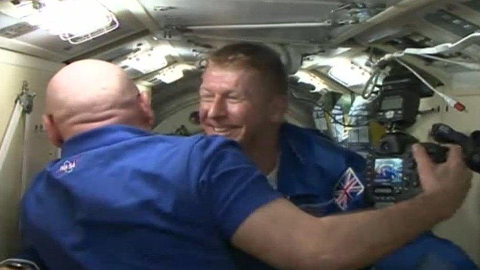 Screen grab from footage issued by European Space Agency of British astronaut Tim Peake emerging from the Soyuz space capsule hatch at the International Space Station.