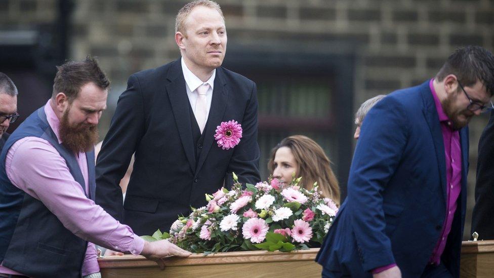 Malcolm Willsher (centre) helps lead his wife's coffin to church