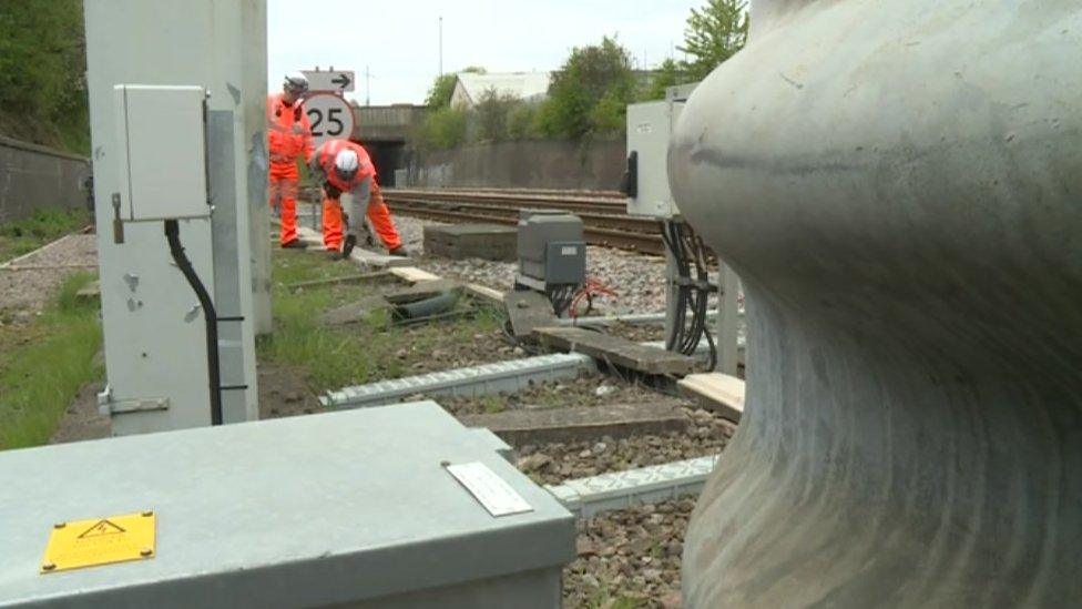 Network Rail staff checking cables