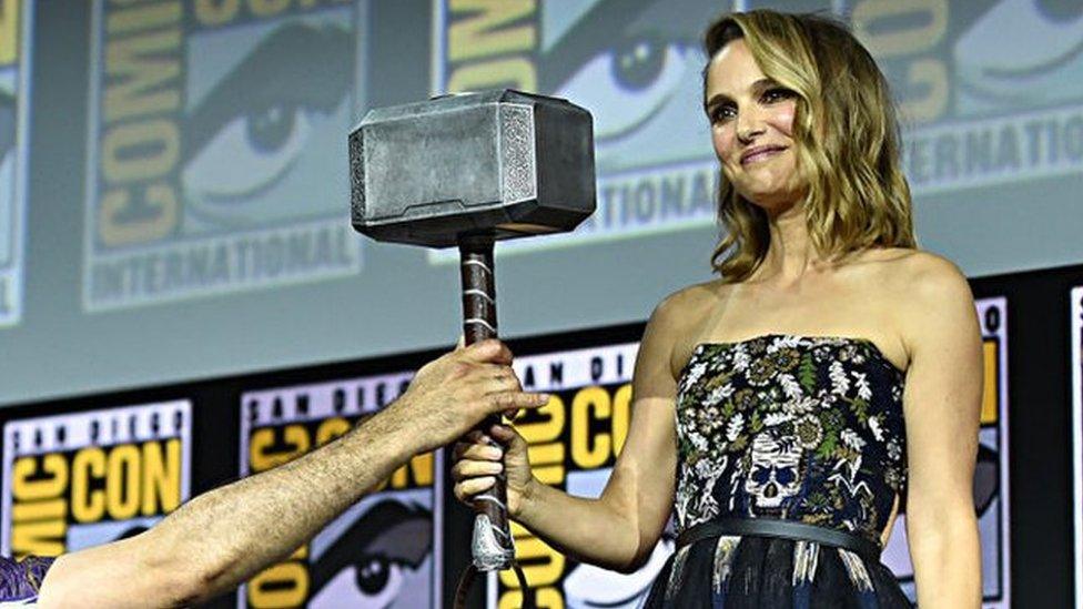 Natalie-Portman-receiving-Thor-Hammer.