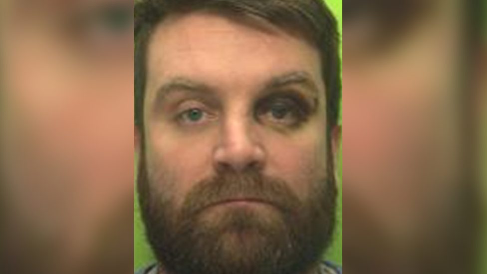 James Gill mugshot - blurred background