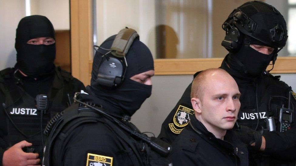 Stephan B., accused of shooting two people after an attempt to storm a synagogue in Halle, arrives for the start of his trial at a local court in Magdeburg, Germany, July 29, 2020