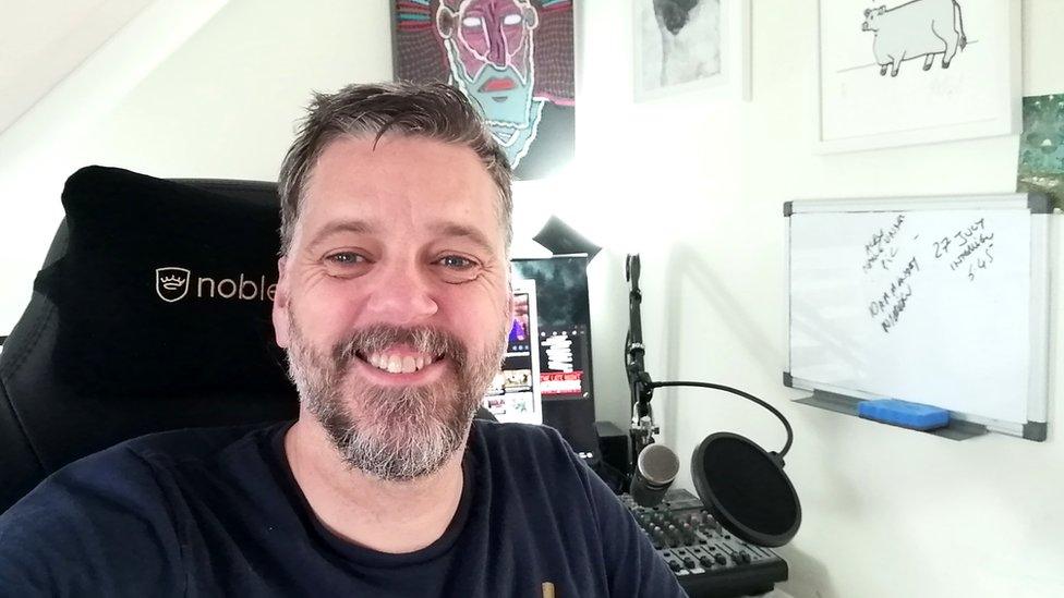 Iain Lee at his desk