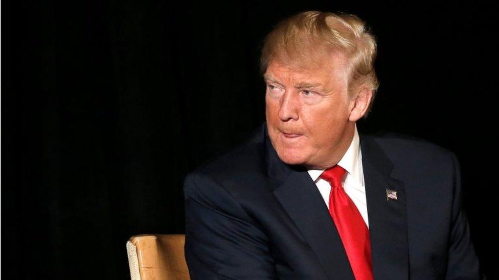 Republican presidential nominee Donald Trump listens to a question as he appears at the "Retired American Warriors" conference during a campaign stop in Herndon, Virginia.