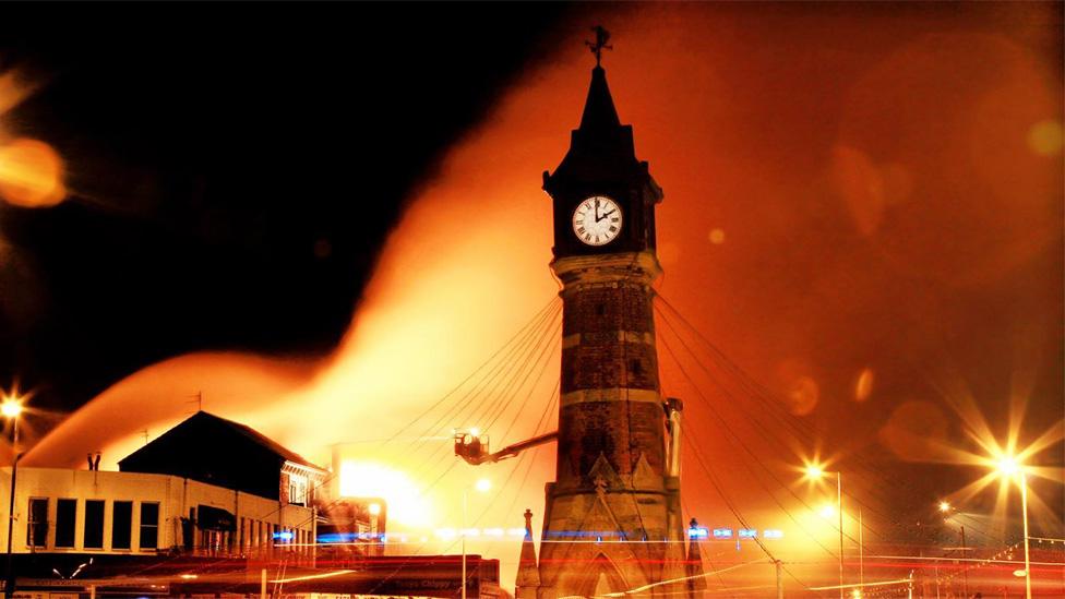 Tower with flames behind