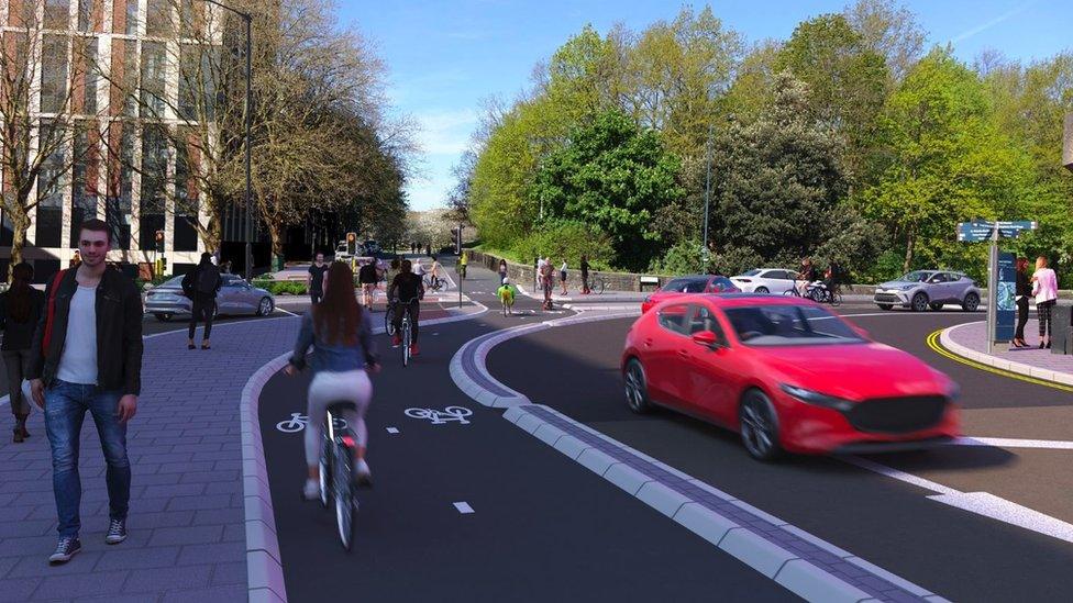 image showing what the new cycle route will look like upon completion. There are two cycle lanes to the left of the road.