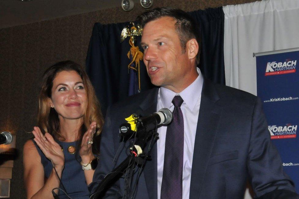 Mr Kobach speaks to supporters on election night as the votes were still coming in.