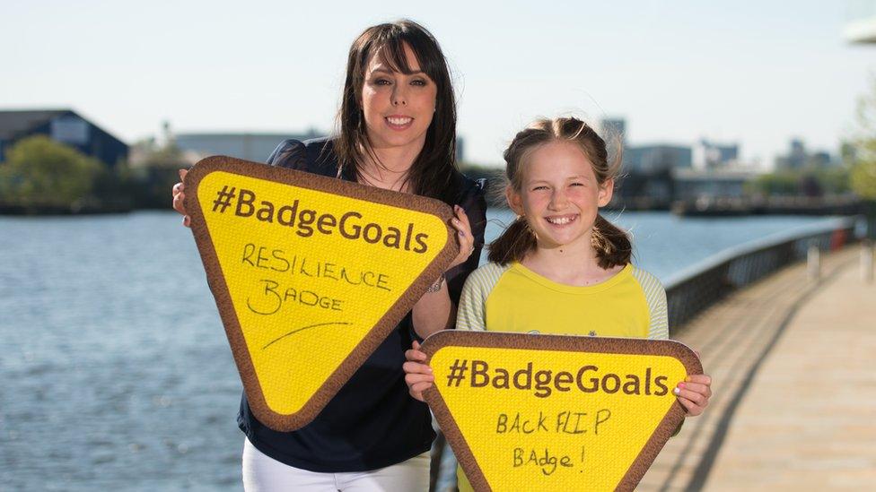 Gymnast Beth Tweddle with Brownie show their badge goals