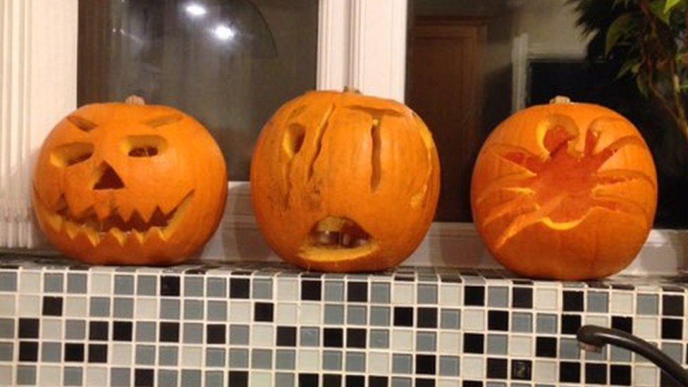 Carvings in three pumpkins