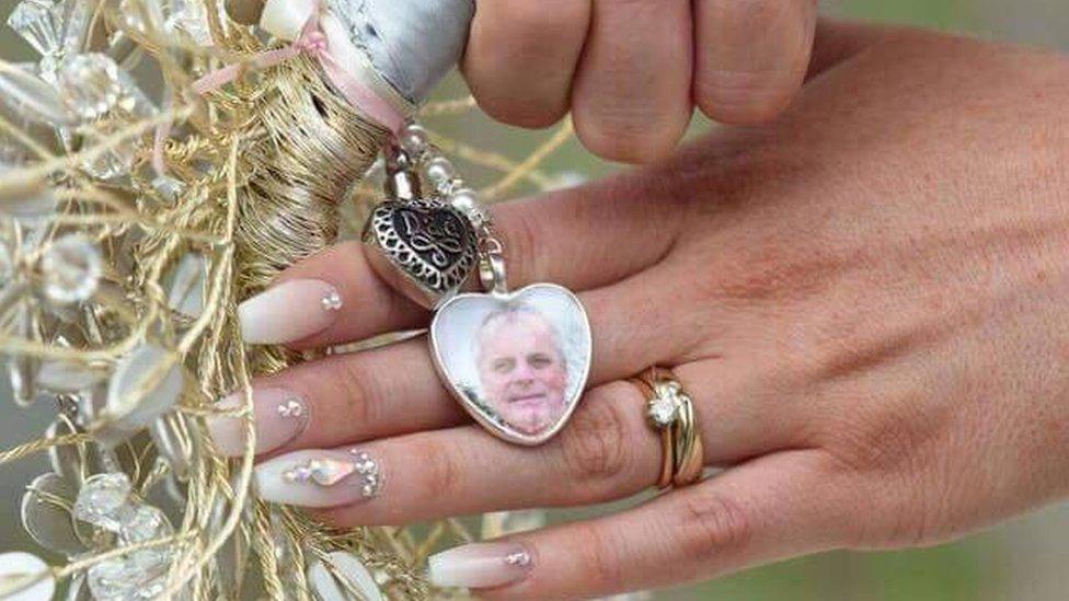 Ashes, locket, bouquet and hands