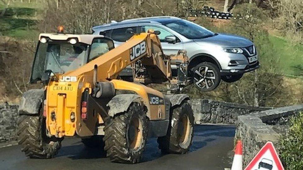 Car recovered after flooding at Llanfair Talhaiarn