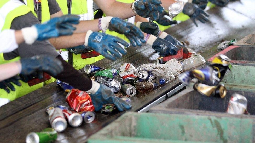 Tin cans being sorted