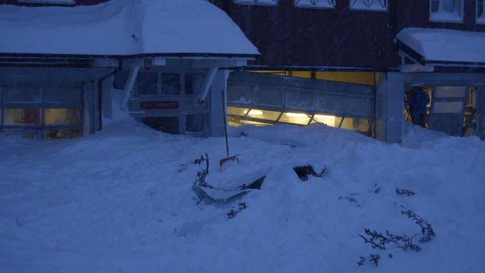 Snow covers a building door at Santis-Schwaegalp mountain area after an avalanche, in Switzerland January 10, 2019.