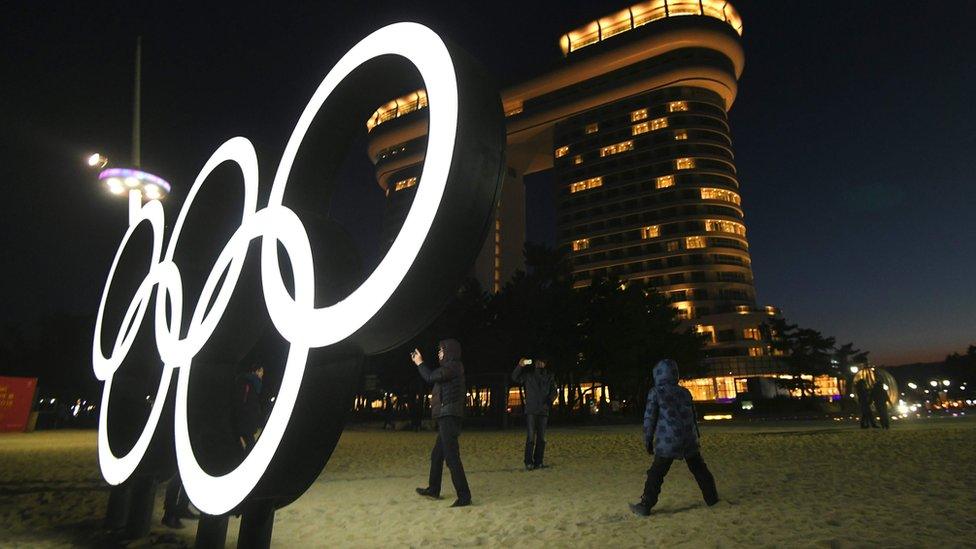 The Olympic rings light up at night on Gyeongpo beach, Gangneung