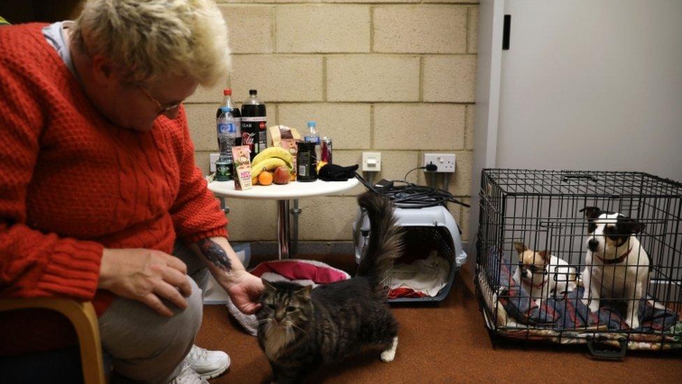 A woman with her pets in Jaywick