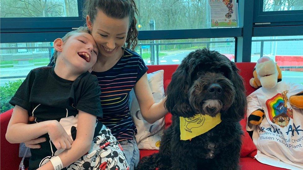 Harvey Hawkins with his mum Jamie-Louise Wallace and Nico the dog