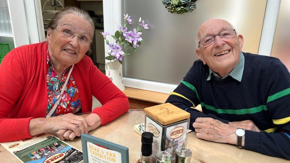 Margaret and John Lawes photographed in a restaurant