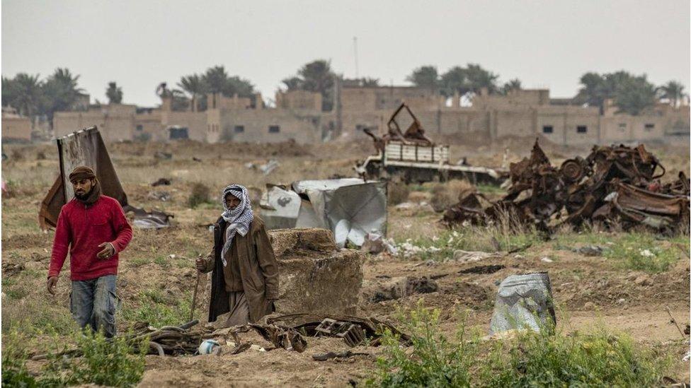 damaged land in the eastern Syrian village of Baghouz on March 13, 2020, a year after the fall of the Islamic State's (IS) caliphate