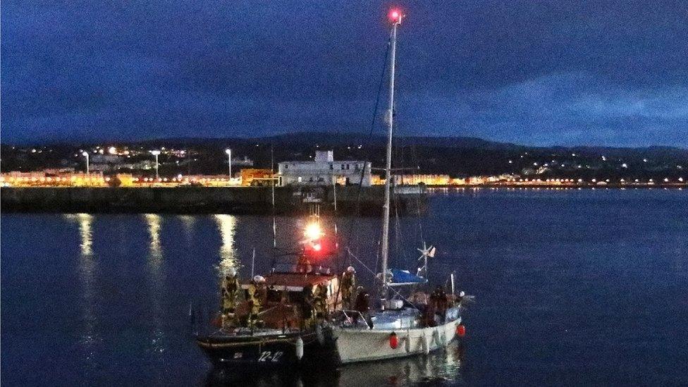 Douglas lifeboat towing yacht back to Douglas Harbour