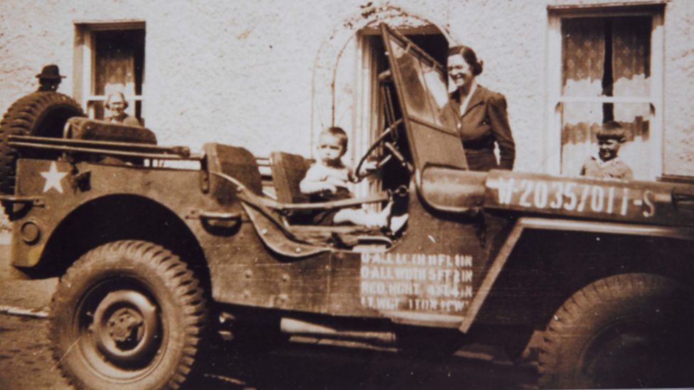 Child in US jeep