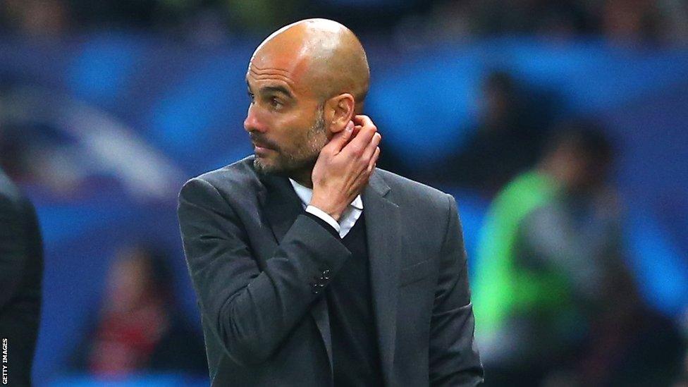 Pep Guardiola scratching his face