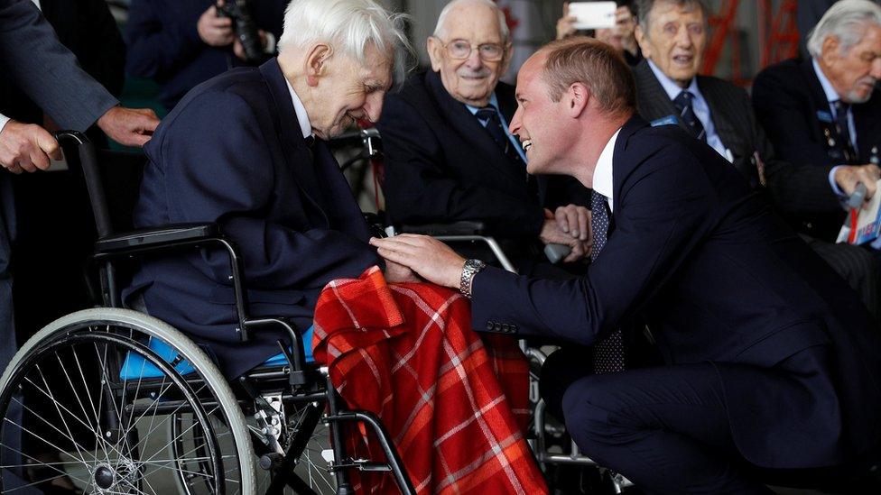 Prince William, patron of the Battle of Britain Memorial Flight, speaks with Ken Wilkinson, Battle of Britain pilot