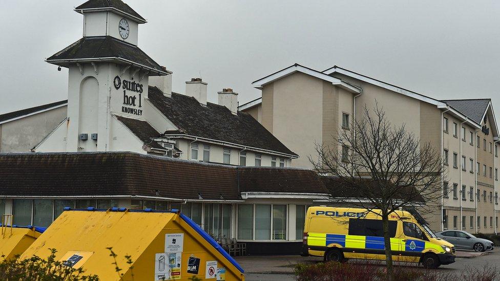 police van outside the hotel on Saturday morning