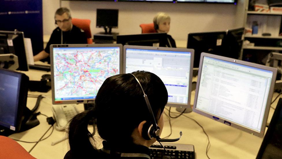 Officers at work in a control room