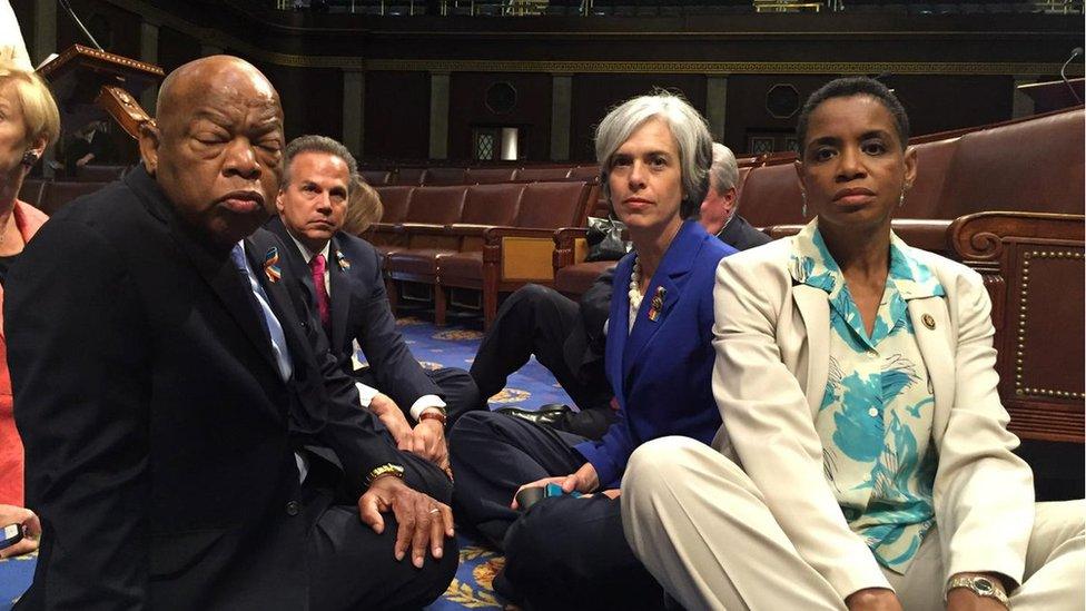 A photo tweeted from the floor of the U.S. House by Rep. Donna Edwards (R) shows Democratic members of the U.S. House of Representatives, including herself and Rep. John Lewis (L) staging a sit-in on the House floor "to demand action on common sense gun legislation" on Capitol Hill in Washington, United States, June 22, 2016.