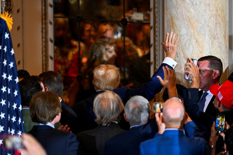 Former US president Donald Trump leaves after speaking during a press conference following his court appearance over an alleged 'hush-money' payment, at his Mar-a-Lago estate in Palm Beach, Florida, on April 4, 2023.