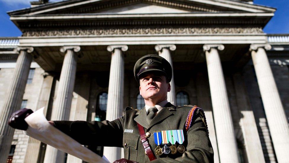 Captain Peter Kelleher from the 27th Infantry Battalion reads the Proclamation at the GPO