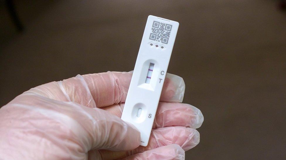 Positive Cassette rapid test for COVID-19, Test Result by Using Rapid Test Device for COVID-19 Novel Coronavirus. - stock photo