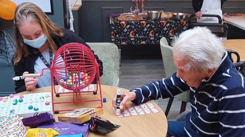 A care home resident playing bingo