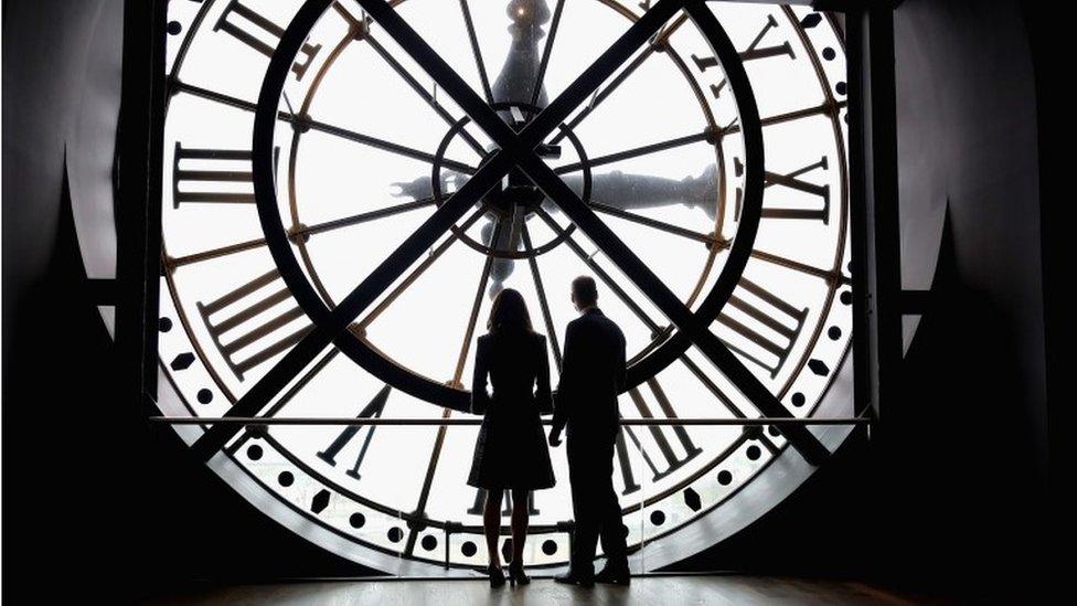 Duke and Duchess looking through the clock at the Musee d'Orsay