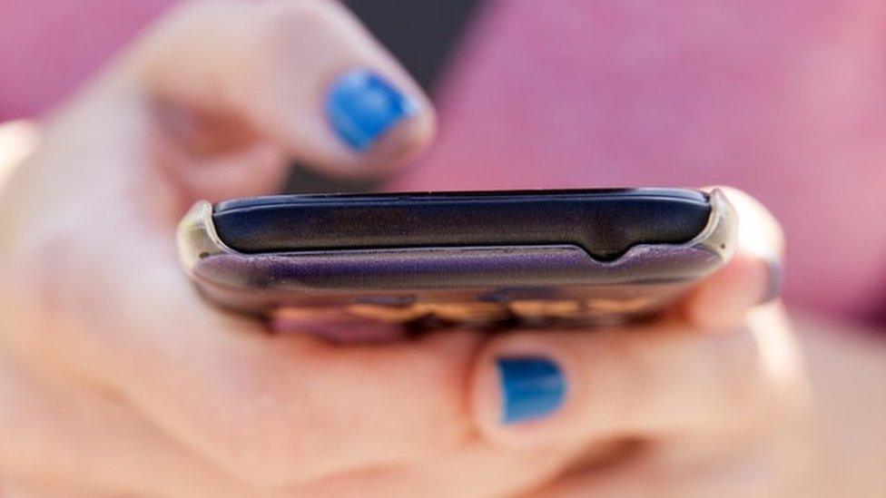 woman holding mobile