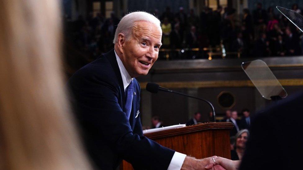 Biden shaking hands after speech