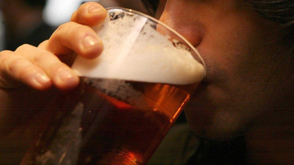 Man drinking pint