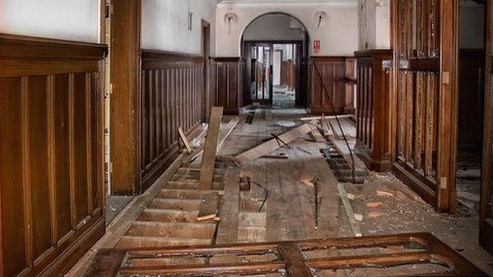 Ripped floorboards inside Ipswich's County Hall