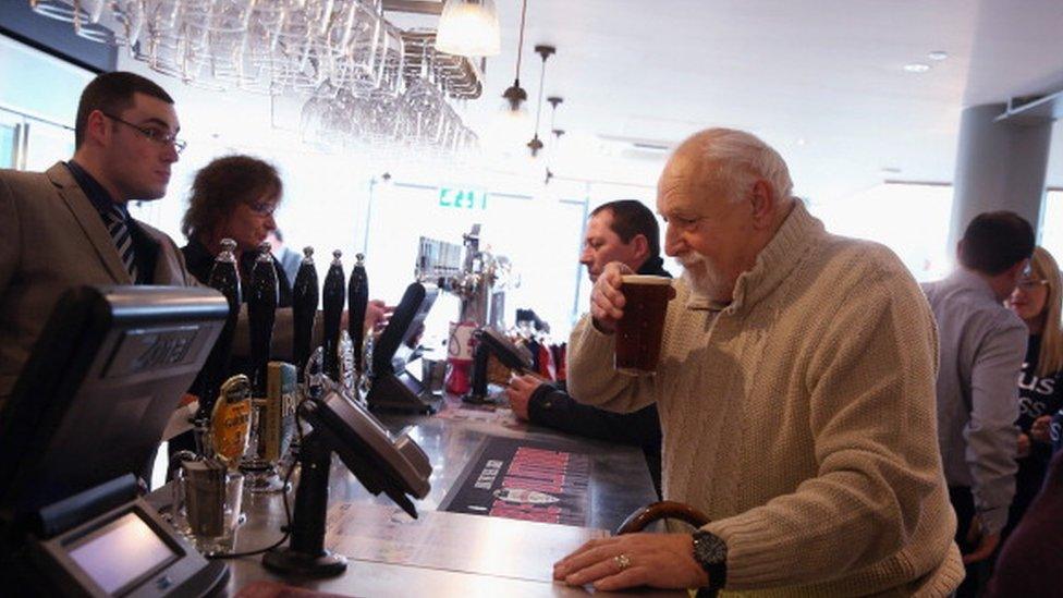 Man drinking in Wethersppons pub