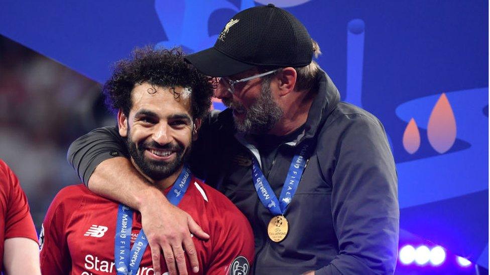 Klopp and Mo Salah celebrate winning the Champions League