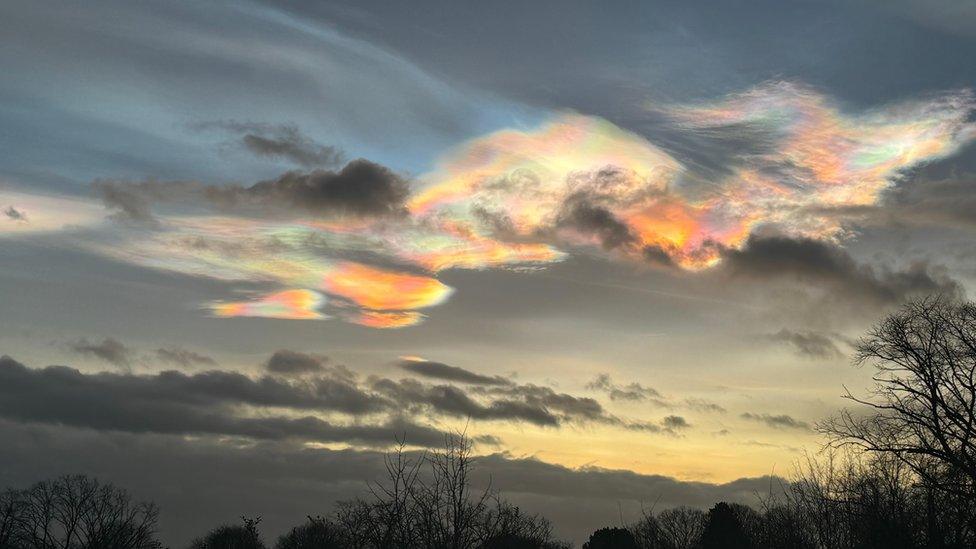 Nacreous clouds in the sky, giving off a beautiful rainbow colour