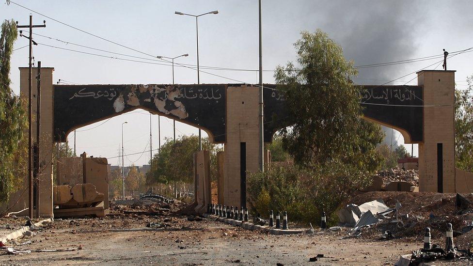 The gate at the entrance of Tal Afar, covered in writing from so-called Islamic State, 30 August 2017