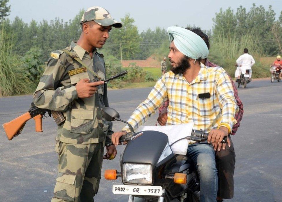 Indian Border Security Force (BSF) personnel do a security check near the India-Pakistan Wagah Border, about 35 kms from Amritsar on September 29, 2016, a