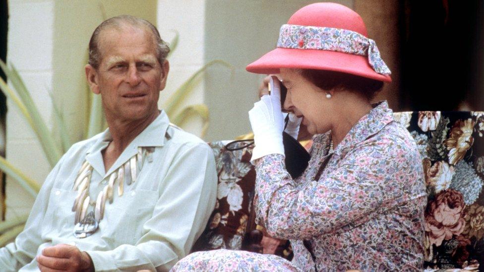 The Queen and Duke of Edinburgh taking photographs during their visit to the South Sea Islands of Tuvalu